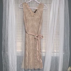 Elegant, lace Candalite dress with flower pattern